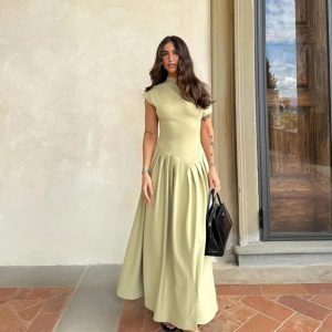 Hot selling round neck slanted shoulder short sleeved dress with a large swing